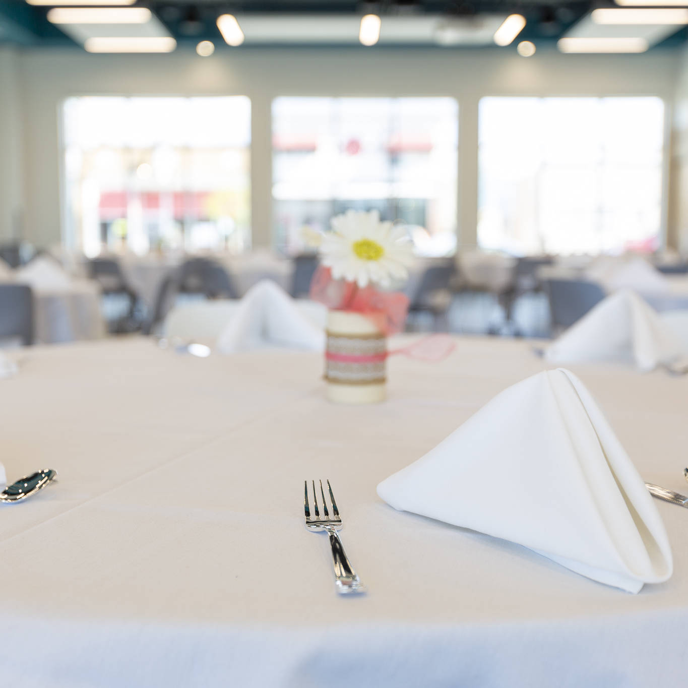 close up image of Tables set up for dining.