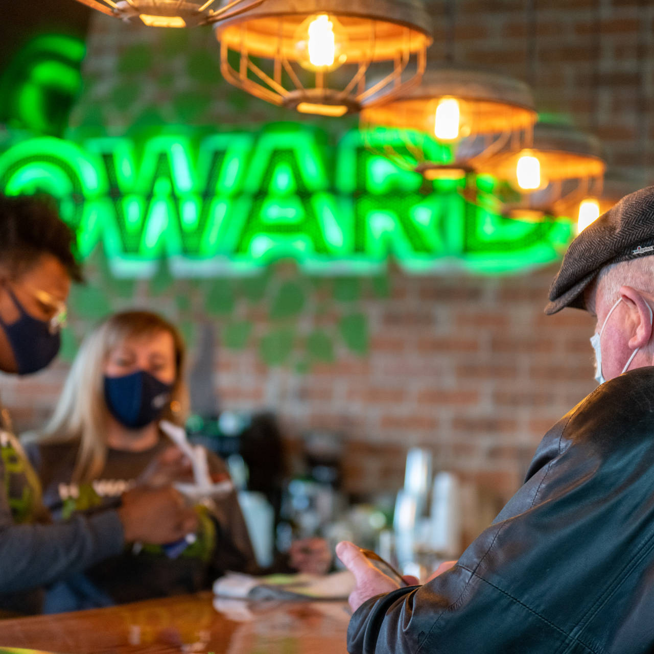People at the bar at Howard Park Public House